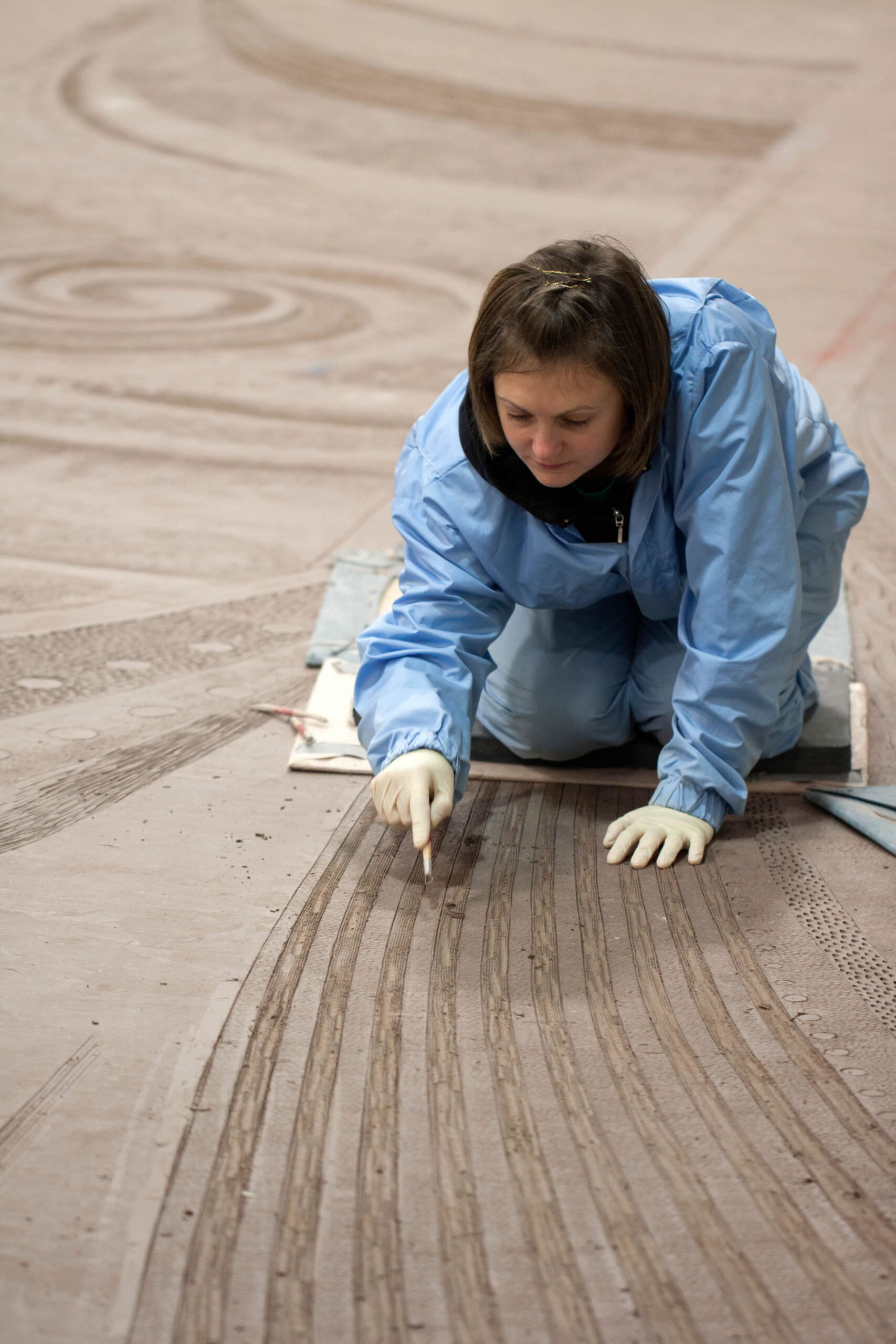 One large malleable sheet is laid on the factory floor - artists and clay workers move around using a series of protected stepping ‘stones'.